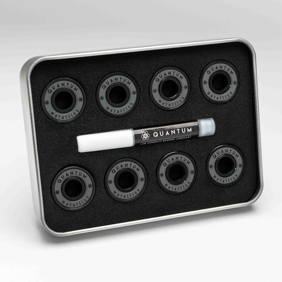 Set of Quantum bearings in a black tray on a white background
